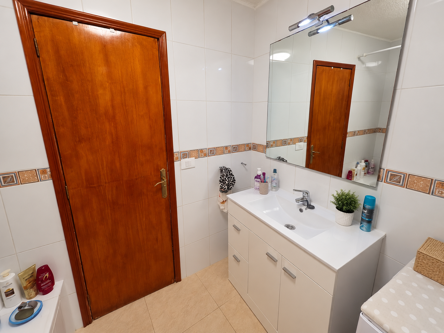 Bright Modern Bathroom with Wooden Door